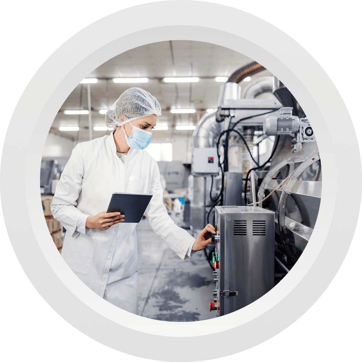 Lab technician operating industrial machinery with tablet